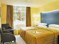 A twin room at Caesar Hotel London